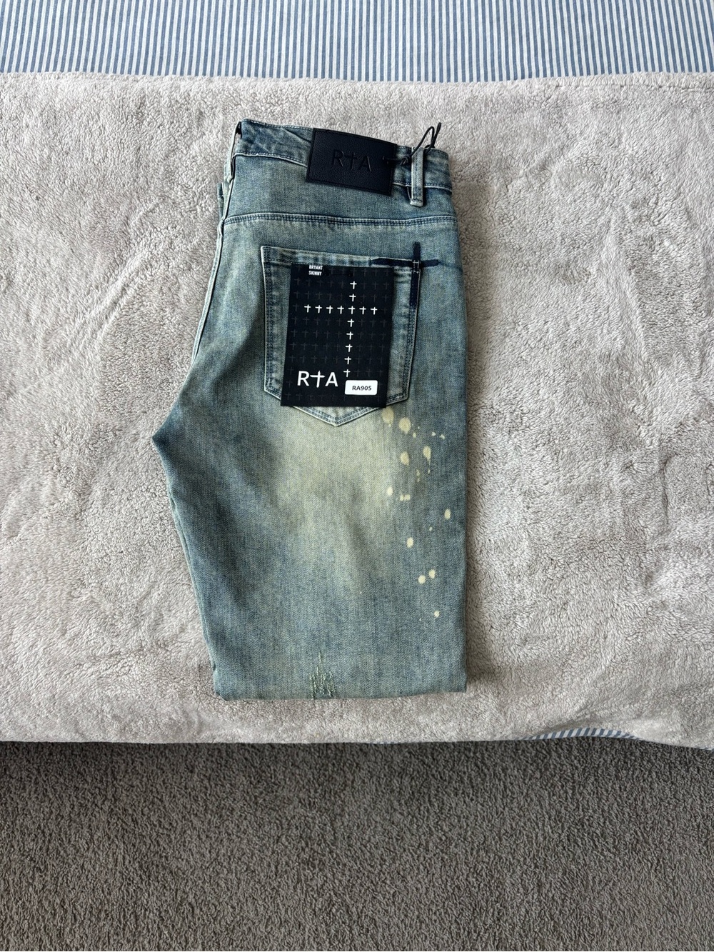 RtA Men's Faded blue skinny Jeans with Black Patch and paint Splatter